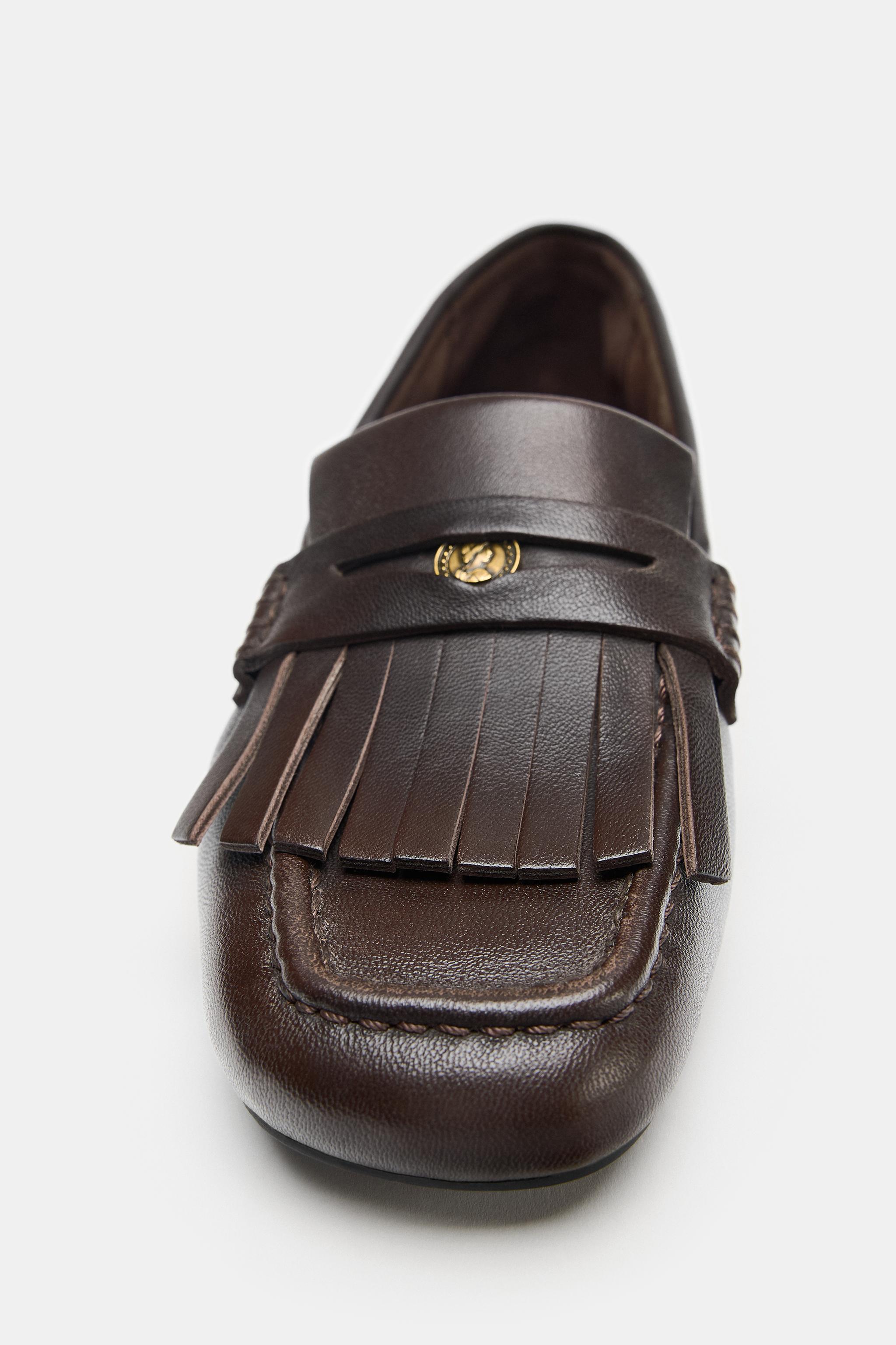 MOCASSINS EN CUIR À FRANGES